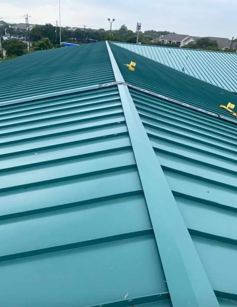 Green commercial metal roof ridge and valley for Metal Roof Repair in Pine Hills